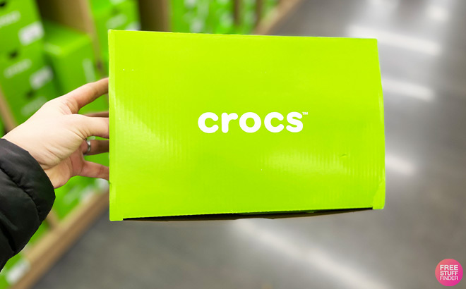 A Person Holding Crocs Shoe Box