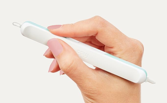 A Person Holding a Frida Baby 3 in 1 Nose Nail Ear Picker A Person Holding a Frida Baby 3 in 1 Nose Nail Ear Picker