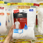 A Person Holding a Pack of Hanes Mens Crew Tee Shirts