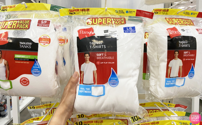 A Person Holding a Pack of Hanes Mens Crew Tee Shirts