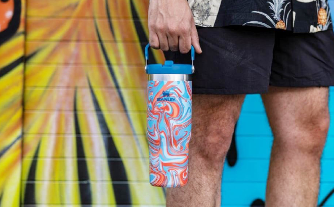 A Person Holding a Stanley IceFlow Stainless Steel Tumbler A Person Holding a Stanley IceFlow Stainless Steel Tumbler