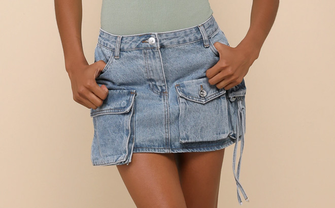 A Person Wearing Steve Madden Evalina Light Blue Denim Mid Rise Cargo Mini Skirt A Person Wearing Steve Madden Evalina Light Blue Denim Mid Rise Cargo Mini Skirt
