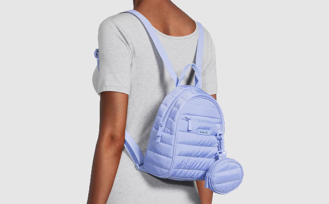A Person Wearing a Reebok Womens Luna Quilted Mini Backpack