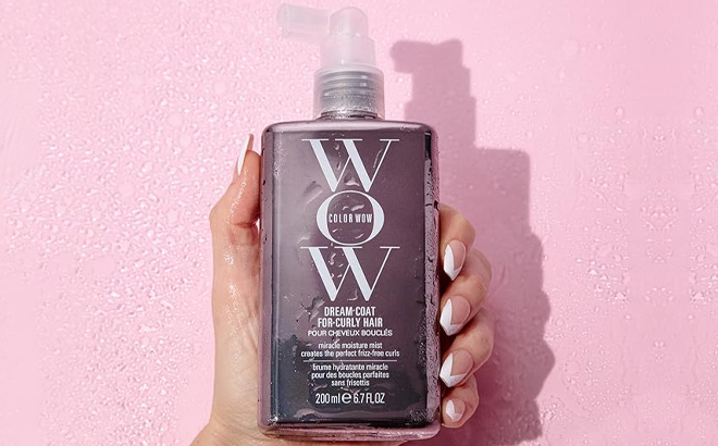 A Woman Holding Color Wow Dream Coat for Curly Hair A Woman Holding Color Wow Dream Coat for Curly Hair