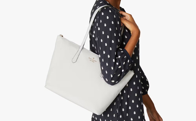 A Woman Wearing Kate Spade Kitt Nylon Large Tote in Platinum Gray A Woman Wearing Kate Spade Kitt Nylon Large Tote in Platinum Gray