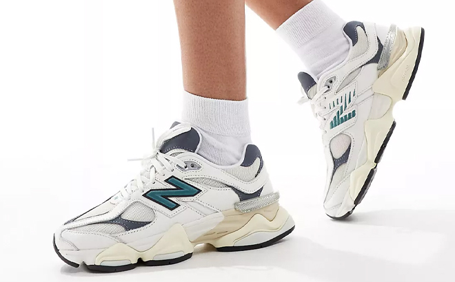 A Woman Wearing New Balance 9060 Sneakers A Woman Wearing New Balance 9060 Sneakers