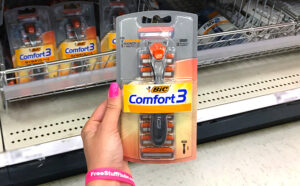 Hand holding BIC Comfort 3 Disposable Razor Kit