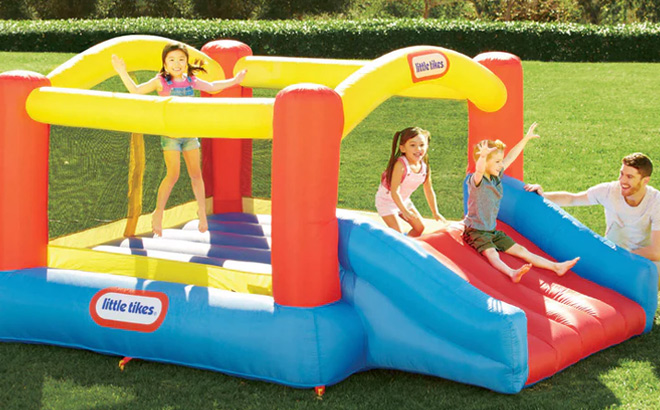 Kids Playing in Little Tikes Jump n Slide Inflatable Bouncer Kids Playing in Little Tikes Jump n Slide Inflatable Bouncer