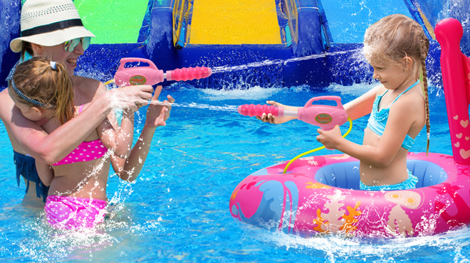 A Family Playing in a Pool Using a Pool Float with Water Gun A Family Playing in a Pool Using a Pool Float with Water Gun