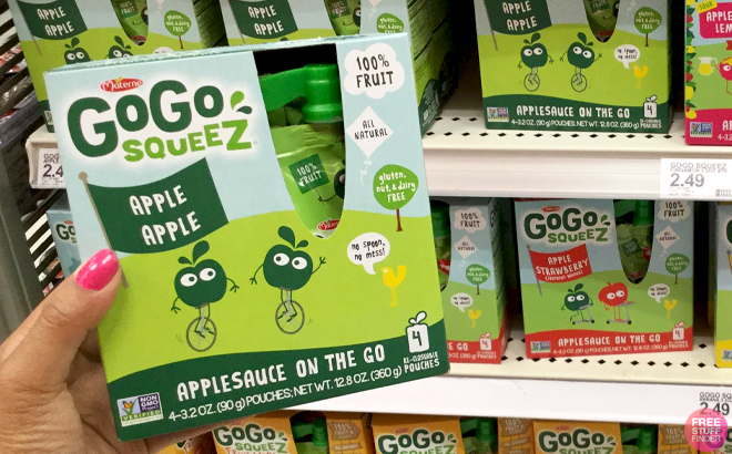 A Hand holding GoGo squeeZ Snack Pouches 4 Pack A Hand holding GoGo squeeZ Snack Pouches 4 Pack
