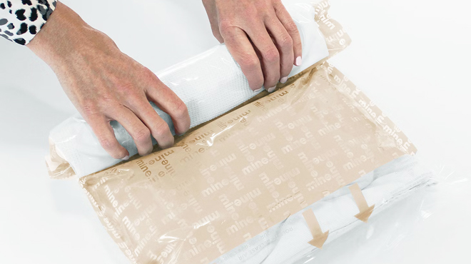 A Person Holding a Compression Bag A Person Holding a Compression Bag