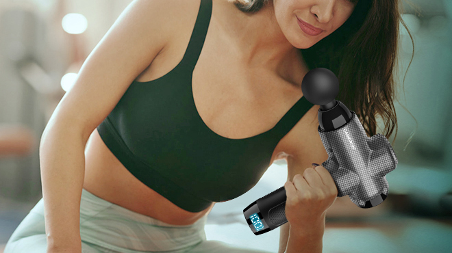 A Person Holding a Deep Tissue Massage Gun A Person Holding a Deep Tissue Massage Gun