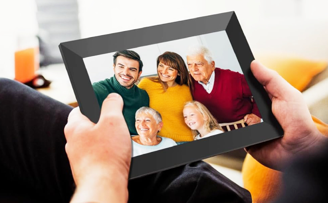 A Person Holding a Uhale Digital Picture Frame A Person Holding a Uhale Digital Picture Frame