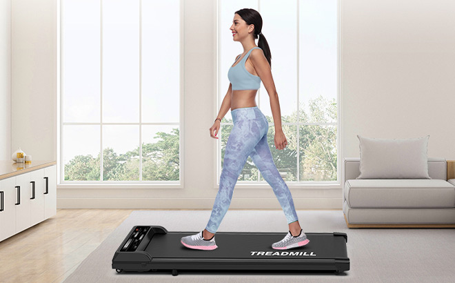 A Person Using Walking Pad Treadmill A Person Using Walking Pad Treadmill