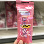 A Woman Holding BIC Silky Touch Disposable Razors