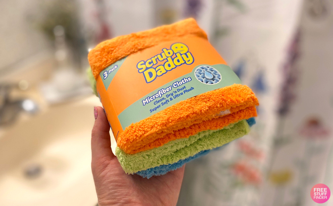 A Woman Holding Scrub Mommy 3 Piece Microfiber Towels Set A Woman Holding Scrub Mommy 3 Piece Microfiber Towels Set