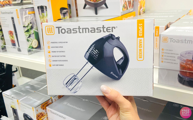 A Woman Holding Toastmaster Hand Mixer A Woman Holding Toastmaster Hand Mixer