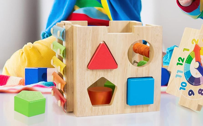 Children Playing with the Bravmate Wooden Activity Cube Children Playing with the Bravmate Wooden Activity Cube