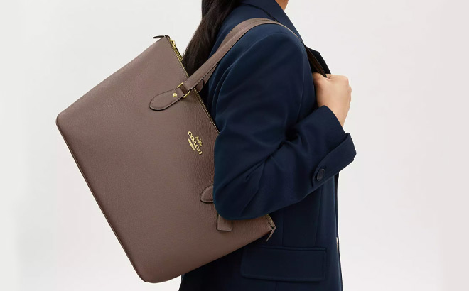 Coach Outlet Gallery Tote Bag on a Gray Background Coach Outlet Gallery Tote Bag on a Gray Background