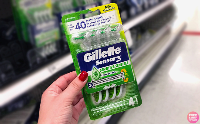 Hand holding Gillette Sensor3 Disposable Razor 4 Count Hand holding Gillette Sensor3 Disposable Razor 4 Count