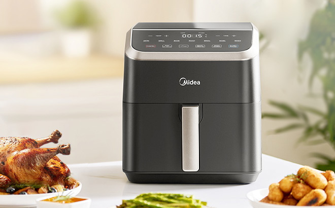 Midea 5 5 Quart HeatXpress 9 in 1 Air Fryer on the Table Midea 5 5 Quart HeatXpress 9 in 1 Air Fryer on the Table