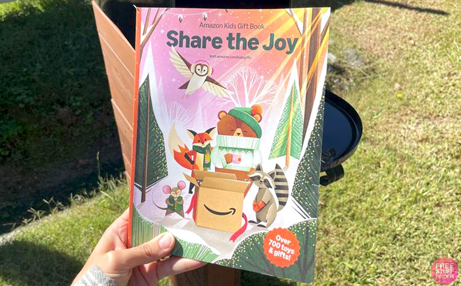 A Hand holding Amazon Kids Gift Book A Hand holding Amazon Kids Gift Book