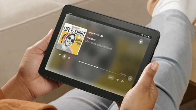 A Woman Listening to Music on the Amazon Fire HD 8 Plus Tablet