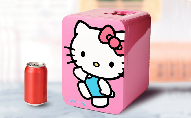 Hello Kitty Pink Mini Fridge with a Can of Soda on a Table Hello Kitty Pink Mini Fridge with a Can of Soda on a Table