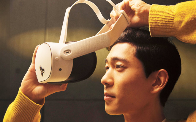 A Man Putting Meta Quest 3S VR Headset On A Man Putting Meta Quest 3S VR Headset On