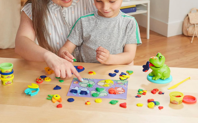 A Mother and Child Playing with Play Doh Frog n Colors Starter Set A Mother and Child Playing with Play Doh Frog n Colors Starter Set