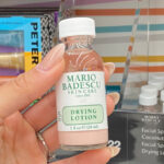 A Person Holding Mario Badescu Drying Lotion