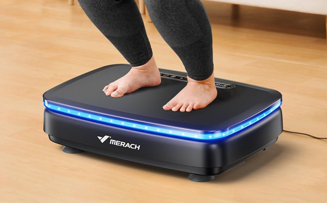 A Person Using the Merach VIbration Exercise Plate on the Floor A Person Using the Merach VIbration Exercise Plate on the Floor