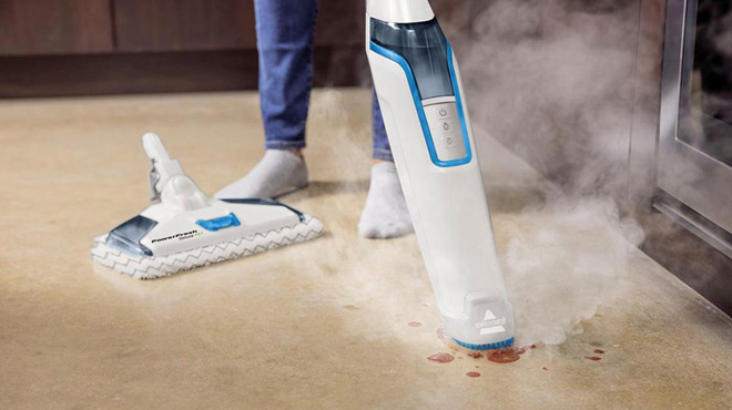 A Woman Cleaning a Floor Stain with Bissell PowerFresh Deluxe Pet Scrubbing Steam Mop with SpotBoost Brush A Woman Cleaning a Floor Stain with Bissell PowerFresh Deluxe Pet Scrubbing Steam Mop with SpotBoost Brush