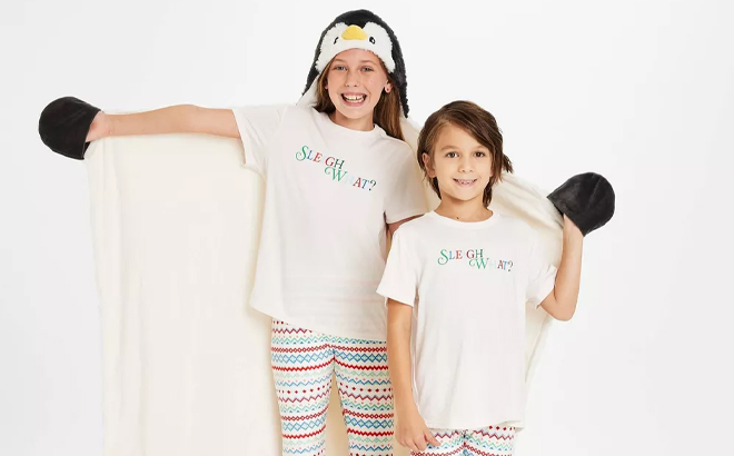 A Child Wearing the Wondershop Penguin Kids Hooded Blanket A Child Wearing the Wondershop Penguin Kids Hooded Blanket