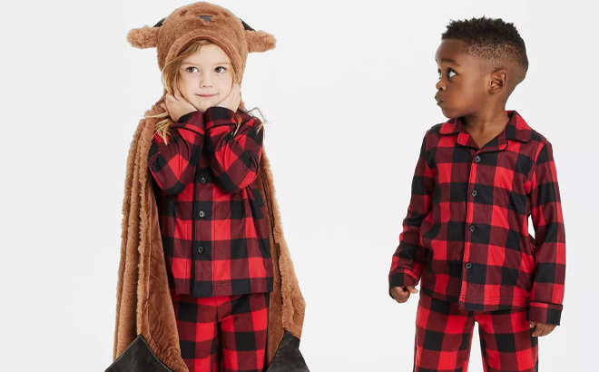 A Child Wearing the Wondershop Reindeer Kids Hooded Blanket A Child Wearing the Wondershop Reindeer Kids Hooded Blanket