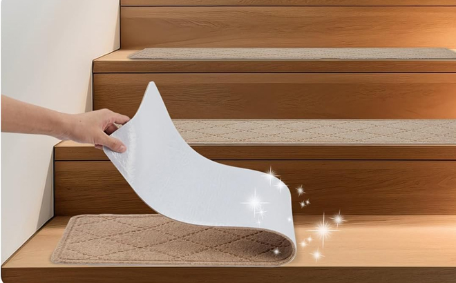 A Person Peeling Off the Non Slip Carpet Stair Treads with Reusable Adhesive A Person Peeling Off the Non Slip Carpet Stair Treads with Reusable Adhesive