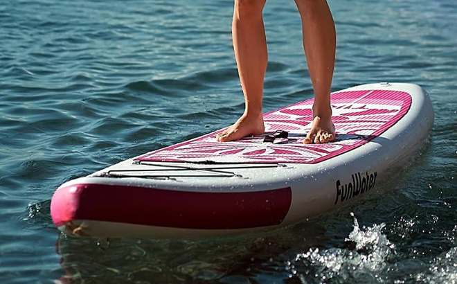 A Person Standing on the FunWater Inflatable Ultra Light Stand Up Paddle Board A Person Standing on the FunWater Inflatable Ultra Light Stand Up Paddle Board