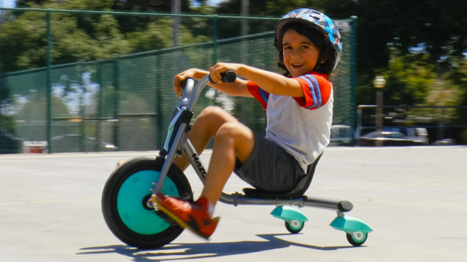 A child riding a Razor RipRider 360 Mini Caster Tricycle A child riding a Razor RipRider 360 Mini Caster Tricycle