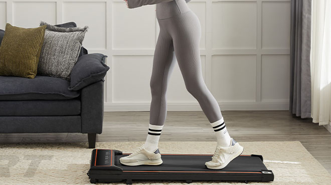 A person using Olixis Compact Armless Treadmill A person using Olixis Compact Armless Treadmill