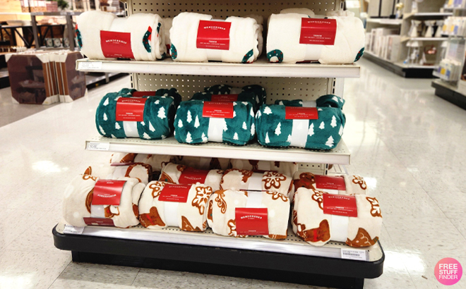 Wondershop Christmas Plush Throw Blankets on a Shelf