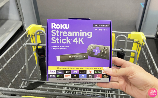 A Person Holding a Roku Streaming Stick 4K A Person Holding a Roku Streaming Stick 4K