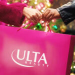 A couple holiding a Pink Ulta Beauty Shopping bag