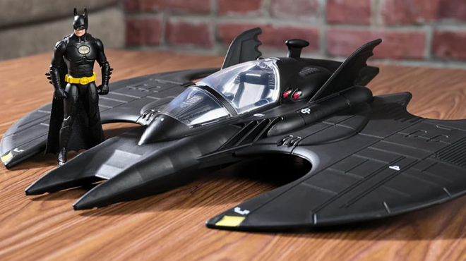 DC Batwing and Batman Figure Set on a Table DC Batwing and Batman Figure Set on a Table