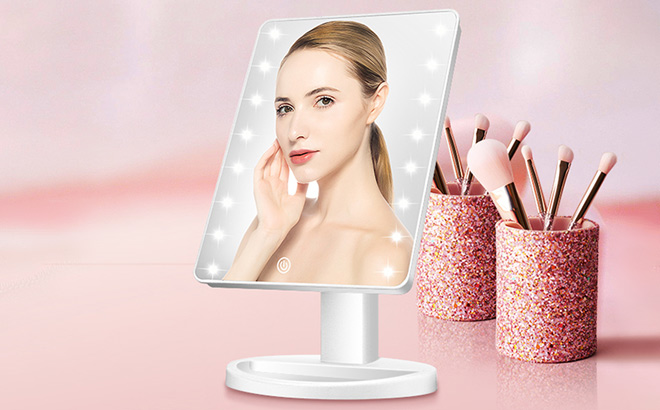 Lighted Vanity Makeup Mirror on the Pink Table Lighted Vanity Makeup Mirror on the Pink Table