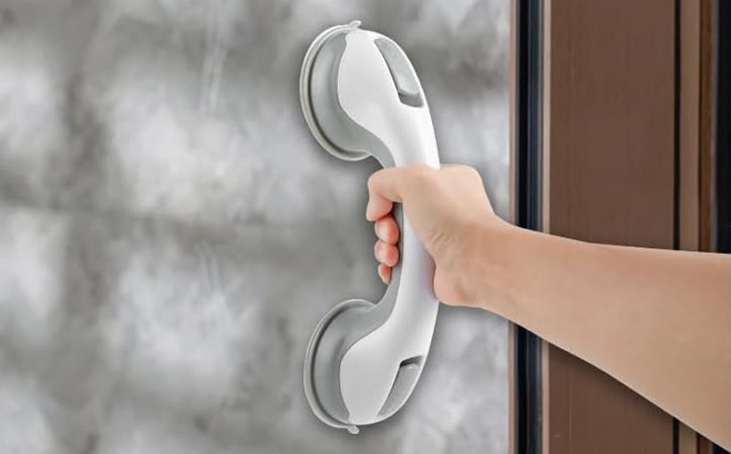 a Person Using Grab Bar in Bathroom a Person Using Grab Bar in Bathroom