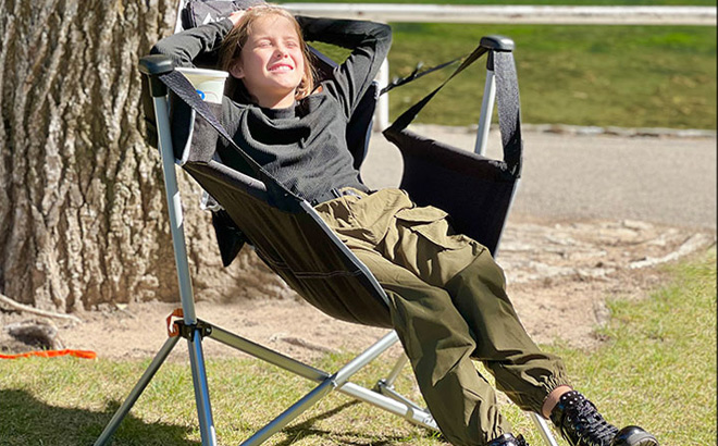 A Kid Sitting on the Kings River Swing Lounger Chair