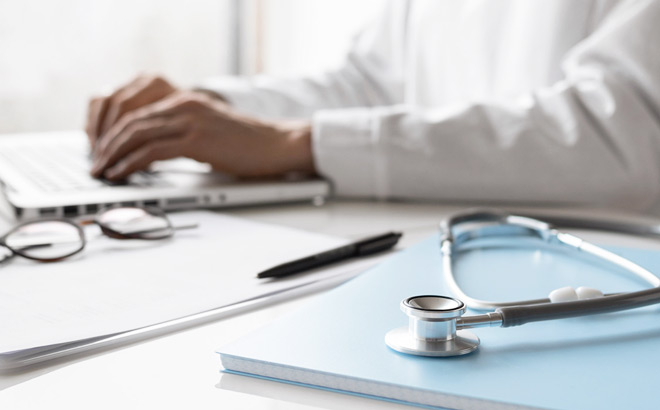 A Medical Professional Working on Laptop