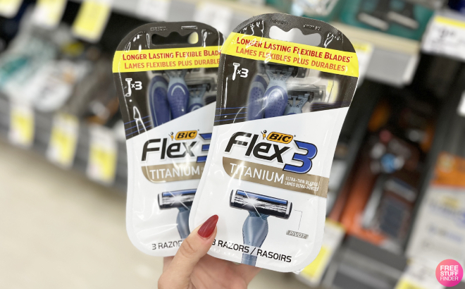 A Person Holding Two Packs of Bic Flex 3 Titanium Razors A Person Holding Two Packs of Bic Flex 3 Titanium Razors