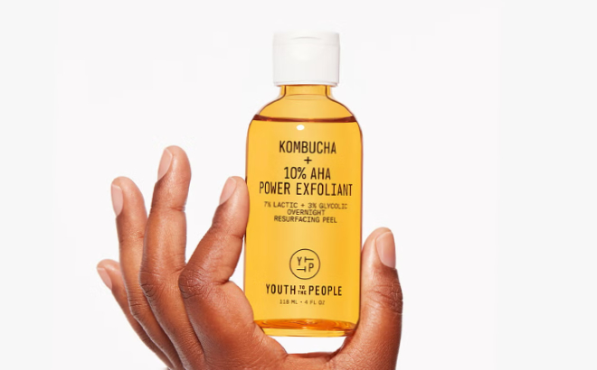 A Person Holding Youth To The People Kombucha 10 Power AHA Exfoliant
