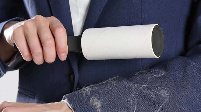 A Person Using a Pet Hair Lint Roller